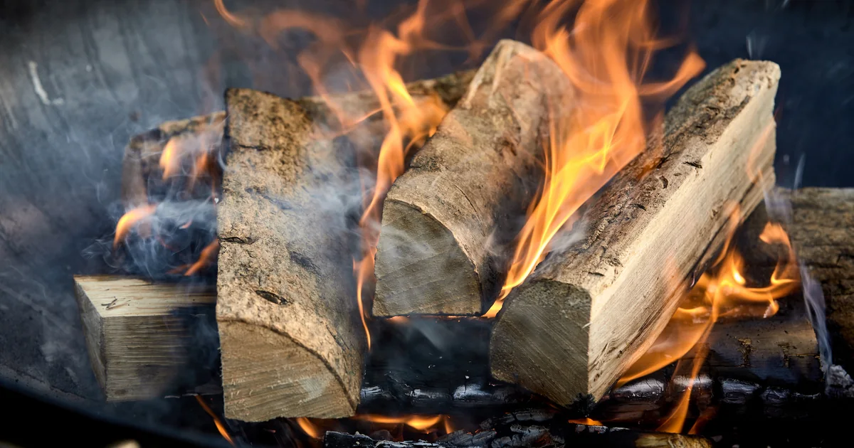 Split firewood burning in an outdoor fire